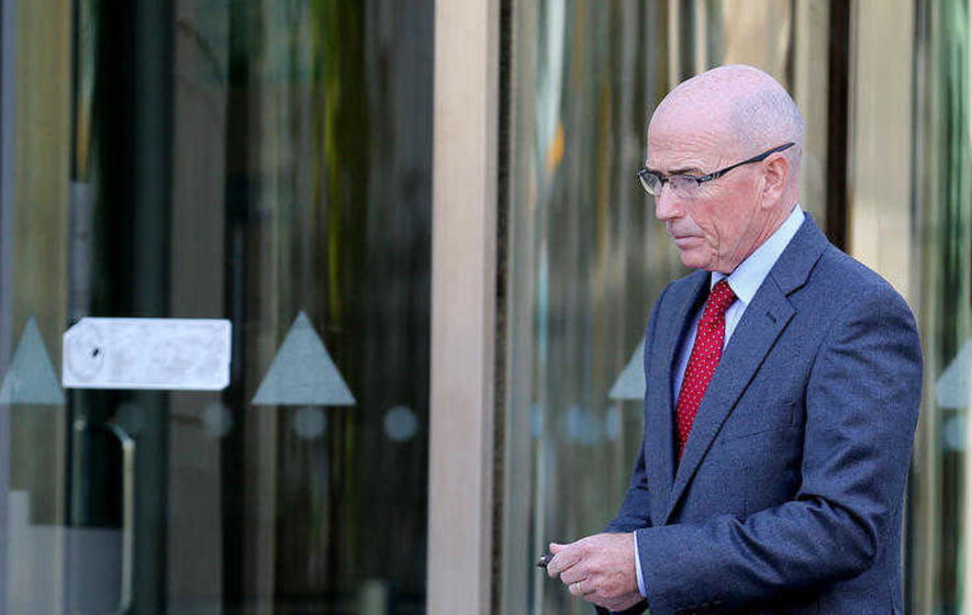 Former PSNI chief Roy Suitters leaves court in Belfast during the Daniel McColgan inquest. Picture by Hugh Russell