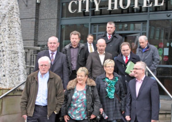 Bloody Sunday relatives Kay and Bernie Duddy, John Kelly and Joe, Mickey and John McKinney emerge from City Hotel yesterday following their meeting with senior PSNI officers. Also included are Peter Madden and Fearghal Shiels, Madden & Finucane Solicitors, MP Mark Durkan and MLA Raymond McCartney