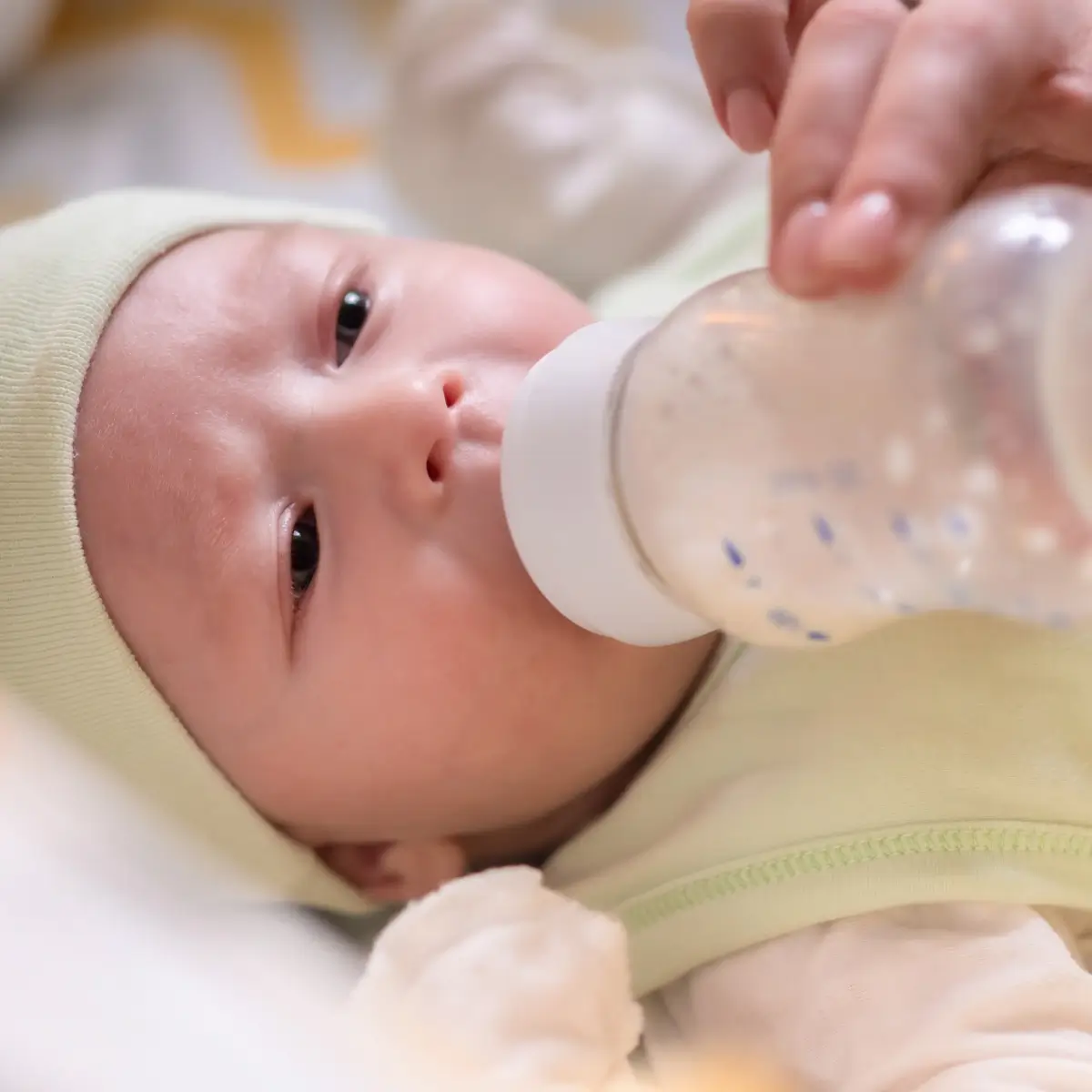 Infant drinking baby formula